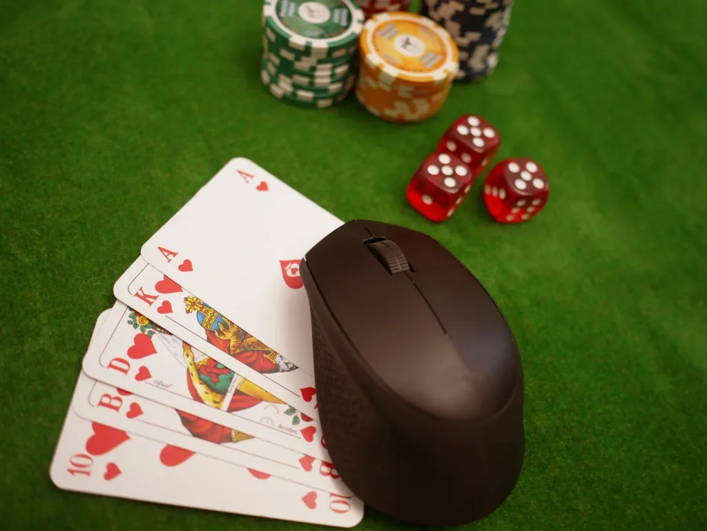 Close-up of a professional poker setup with red and blue chips and playing cards, representing secure EU-licensed online casino platforms in 2026.