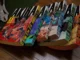 A complete six-volume set of the original Japanese 'Akira' manga by Katsuhiro Otomo, displayed in a stack with distinct colored spines and detailed cover art, sitting next to a pair of metal pliers on a wooden surface, representing how Tsumino Blog highlights iconic and rare manga collections.